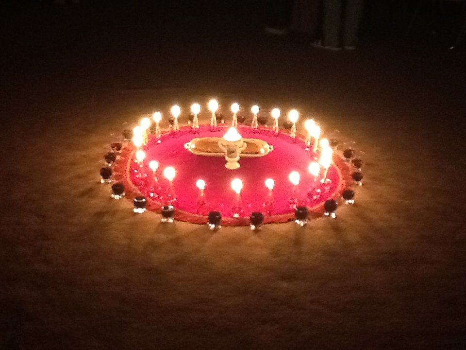 A circle of lit candles around bread and wine, a symbol used during FIRES Encounter programmes